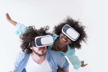 multiethnic couple getting experience using VR headset glasses