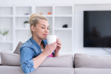 woman enjoying a cup of coffee