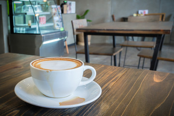 hot coffee mocha with foam milk in vintage cafe