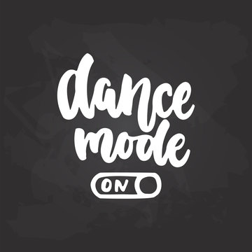 Dance mode On- lettering dancing calligraphy quote drawn by ink in white color on the black chalkboard background. Fun hand drawn lettering inscription.