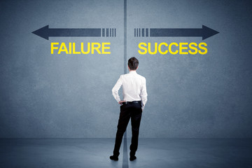 Fototapeta na wymiar Businessman standing in front of success and failure arrow concept