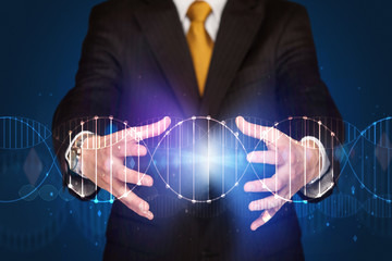 Businessman holding DNA