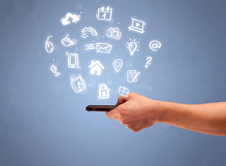 Hand holding tablet phone with drawn icons