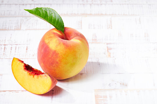 Peaches On White Wood Background