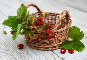 Fototapeta na wymiar Basket with wild strawberries