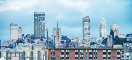 Buildings of Downtown San Francisco from Fisherman's Wharf. San Francisco welcomes 25 million visitors every year