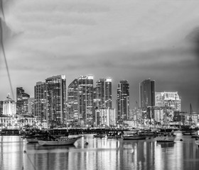 Fototapeta premium San Diego, California. Night view of Downtown buildgs with water reflections