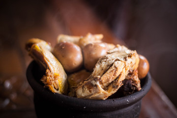gudeg traditional exotic indonesian food with kendil and wooden table