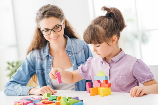 Mother and child playing together at home