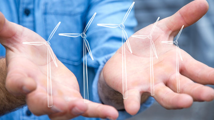Businessman holding renewable energy sketch