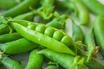 Fresh pea pods and peas closeup, macro