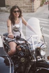 Fototapeta na wymiar Woman on sidecar bike
