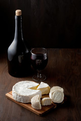 Variety of different cheese with wine