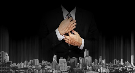 Businessman on black background with black and white panoramic modern city