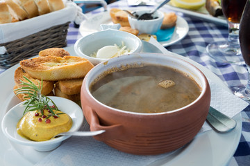 A delicious fish soup poisson served with croutons, chesse and especially made rouille sauce is...