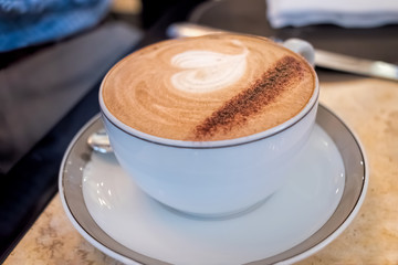 Coffee in cup and saucer with beautiful presentation. 