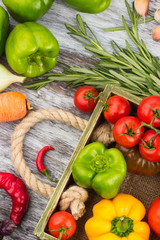 Set of raw vegetables in the wooden tray