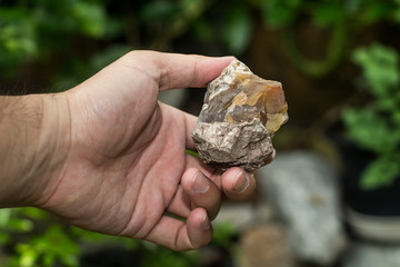 Pick a natural mineral stone, Brown stone