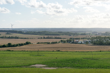 agricultural fields with sea in the background