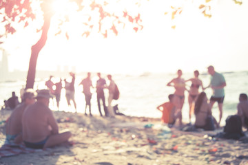 People sit on the beach in Pattaya, Thailand, and the picture is unclear and blurry