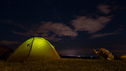Illuminated Tent in front of night sky