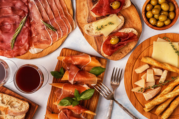 Italian food  background with ham, cheese, olives.
