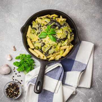 Creamy Zucchini, Mushroom, Peas Pasta In Cast Iron Skillet. Top View, Copy Space.