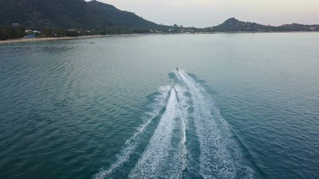 Jetsky Riding in Twilight. Aerial