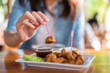 Hand of woman having breakfast.
