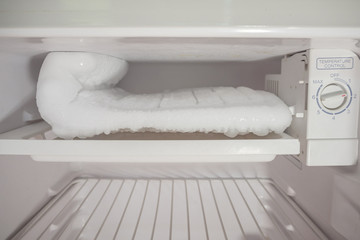 frozen Ice buildup in the freezer of refrigerator - obrazy, fototapety, plakaty