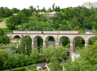 Fototapeta premium The Train Crossing the Passerelle, 24 Arches Viaduct in Luxembourg City, Luxembourg 