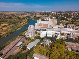 Fototapeta na wymiar Drone pov, aerial view of industrial cityscape with factory buildings