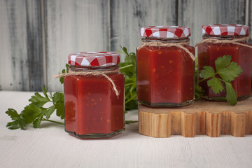 Three Caucasian tomato sauce jars