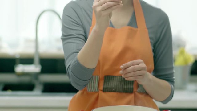 The woman cooks the food. with meat bulion