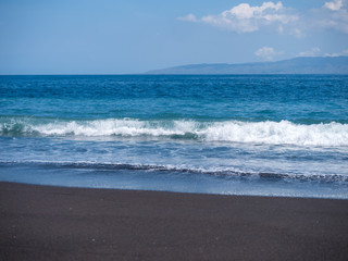 Fototapeta na wymiar Black volcanic beach in eastern Bali Indonesia