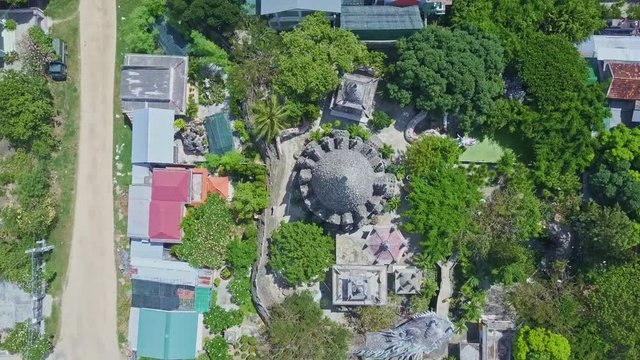 Drone Camera Rotates and Goes down above Buddhist Temple