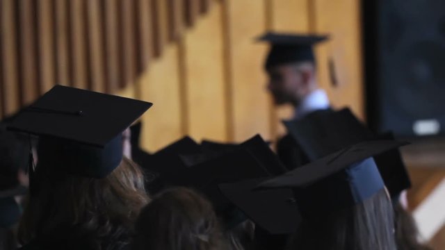 Joyful Female Graduate Walking To Stage To Receive Diploma With Honors