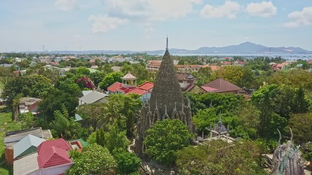 Coral Buddhist Temple Complex by Street against Cityscape