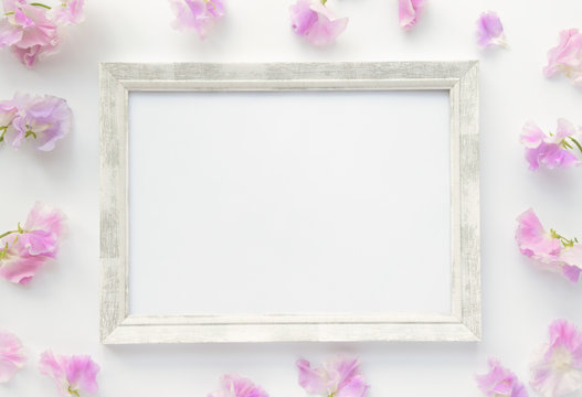Wooden frame with pink flowers