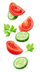 Crédence de cuisine en verre imprimé Légumes Isolated vegetables. Mixed slices of cucumber and tomato floating in the air isolated on white with clipping path