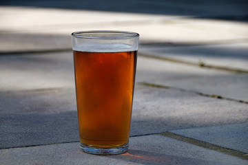 Pint of beer outside on a summer day