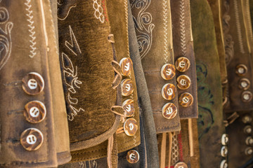 Traditional austrian and bavarian leather pants (lederhosen), closeup of buttons