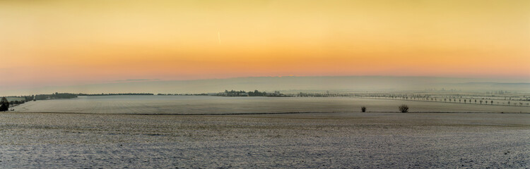 scenic sunrise in snow covered winter landscape in Thuringia