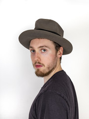 portrait  of cool looking young man looking mature man with hat
