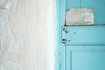 Detail of blue retro old door in mediterranean Greece