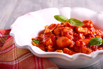 Chicken breast pieces in tomato sauce