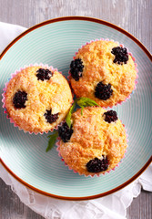 Blackberry cornmeal cupcakes, served