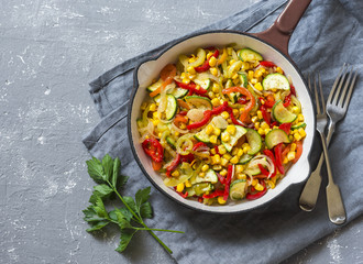 Skillet vegetarian vegetable fajitas on the gray table, top view