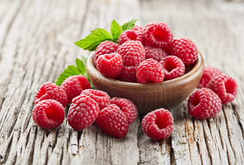 Raspberry on a old wooden background