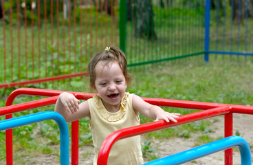 Fototapeta na wymiar child is playing on the playground